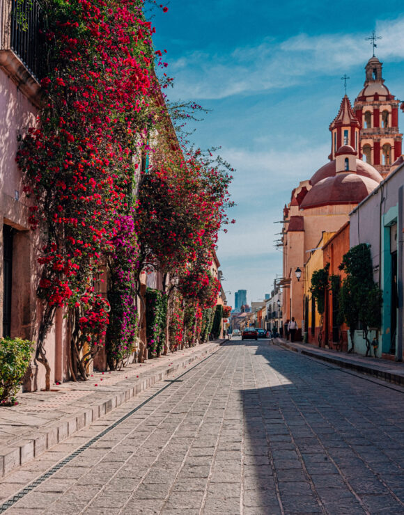 Old town street with bouganvillea in Mexico
